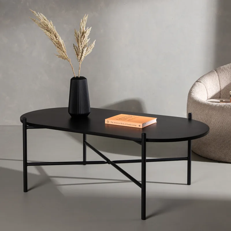 Table basse Pueblo noire, plateau ovale sur pieds en métal à croisillon, vue de face