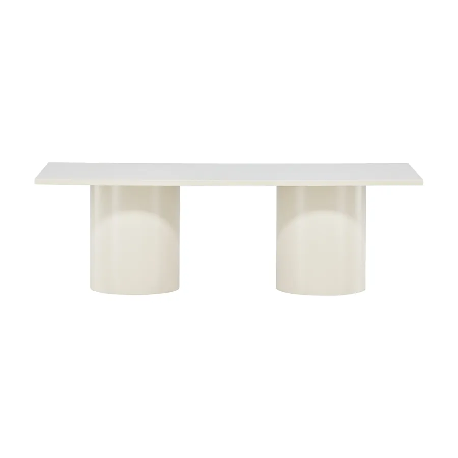 Table basse Sandvika beige brillant sur deux pieds cylindriques, vue de face