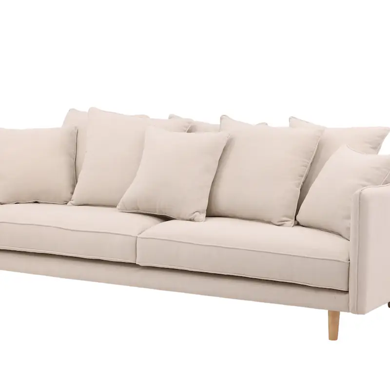 Canapé beige en tissu vu de trois quarts, assise large et coussins de dossier
