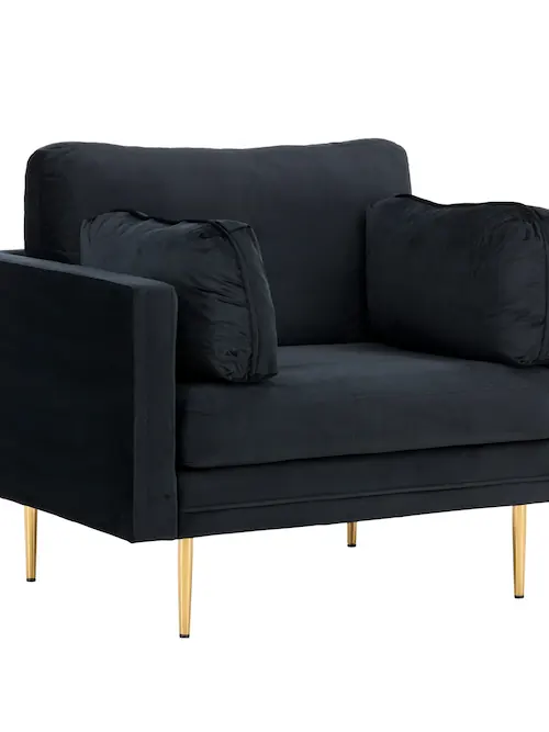 Fauteuil noir de trois quarts, dossier à coussin et pieds dorés