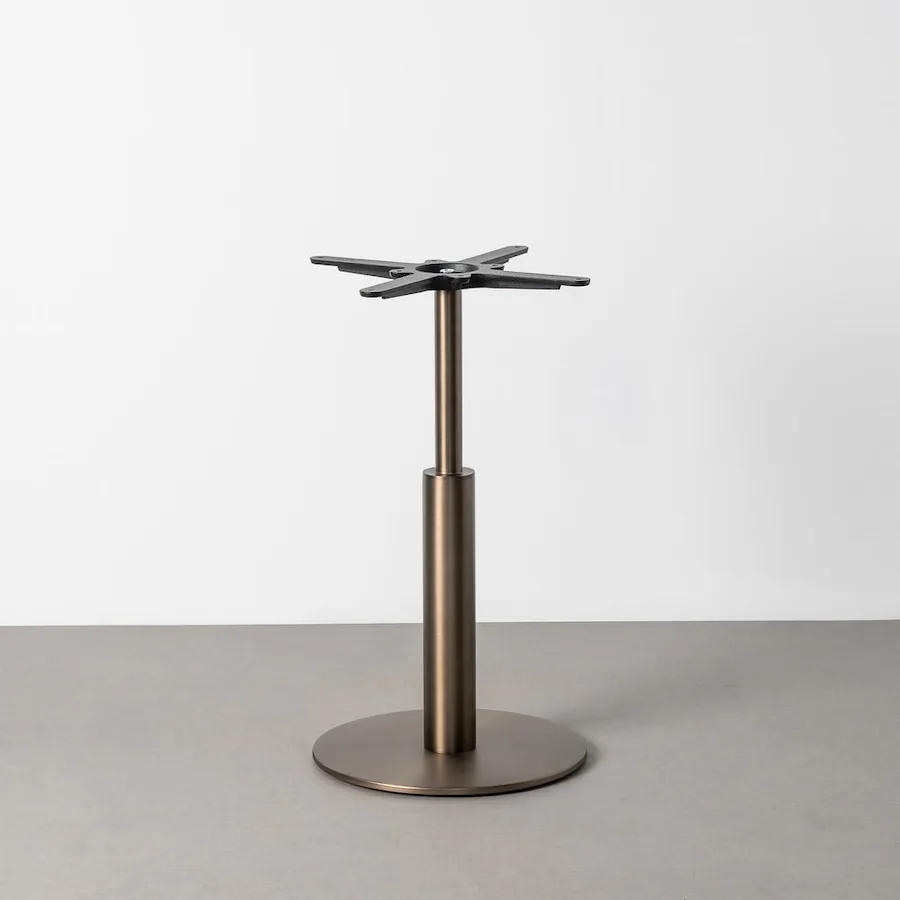 Pieds de table central Ixia finition bronze, long manchon haut, socle rond plat et croisillon noir percé