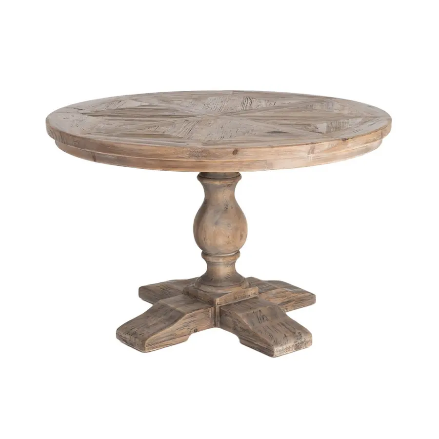 Table ronde en pin recyclé vue de trois quarts sur fond blanc, pied central et base en croix