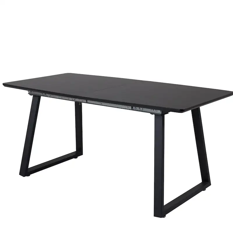 Vue de trois quarts de la table noire, pieds trapézoïdaux et plateau uni