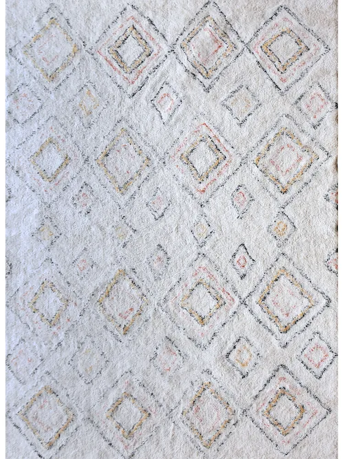 Tapis Salford en coton ivoire à losanges berbères et franges, vu de dessus